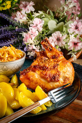 A delicious piece of roasted chicken.