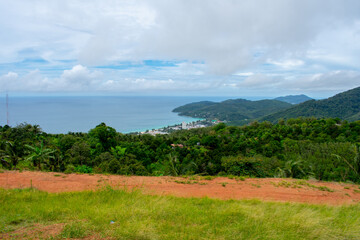 Obraz premium Aerial view from Big Buddha on Coast of Phuket Island in Thailand. Beautiful landscape Jungle and turquoise blue water of Andaman Sea 