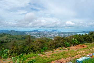 Aerial view from Big Buddha on Coast of Phuket Island in Thailand. Beautiful landscape Jungle and turquoise blue water of Andaman Sea 
