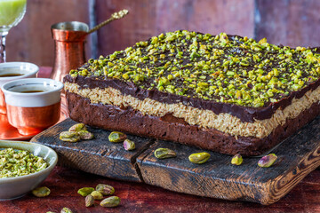 Home baked Dubai chocolate brownie cake with pistachio and kadaifi layer