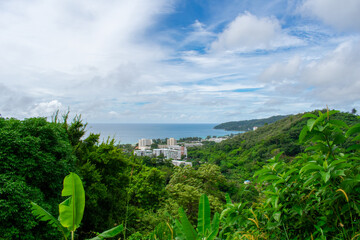 Aerial view from Big Buddha on Coast of Phuket Island in Thailand. Beautiful landscape Jungle and turquoise blue water of Andaman Sea 