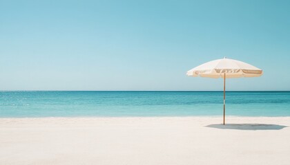 Fototapeta premium Enjoy serene beach views under a large umbrella on pristine white sand with gentle waves and clear blue skies