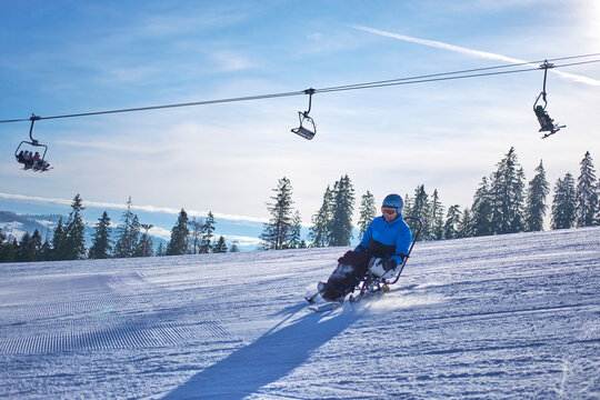 fast skiing by a person in a wheelchair