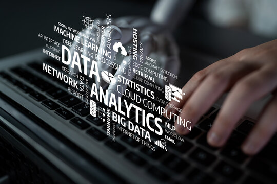 A conceptual image showing a hand typing on a keyboard while surrounded by various data analytics terms, reflecting the importance of technology in modern business. Tessel