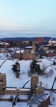 Ithaca, NY, USA - January 24, 2026 Vertical winter aerial video of Cornell University, Ithaca, NY with snow on the ground.
