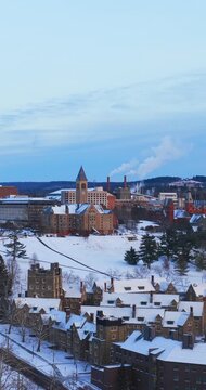 Ithaca, NY, USA - January 24, 2026 Vertical winter aerial video of Cornell University, Ithaca, NY with snow on the ground.
