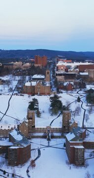 Ithaca, NY, USA - January 24, 2026 Vertical winter aerial video of Cornell University, Ithaca, NY with snow on the ground.

