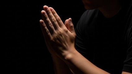 Fototapeta premium Man Praying Hands Dark Background