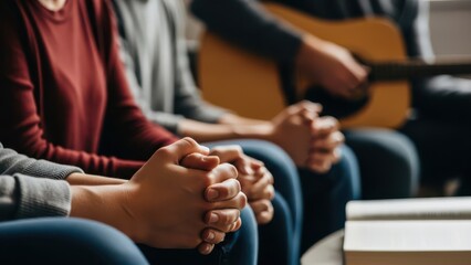 People praying holding hands in circle