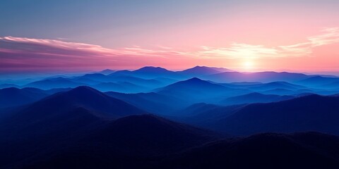 Obraz premium Stunning Pastel Sunset Over Majestic Blue Mountains, Creating a Peaceful and Serene Landscape Scene