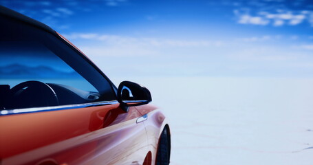 Red sports car on salt flat, poised under vast blue sky, gleaming red paint and aerodynamic silhouette, minimalist horizon evokes speed and freedom, staged © icetray