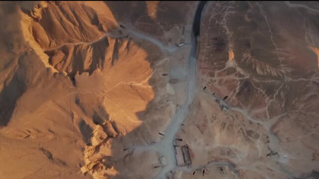 Cinematic Top-Down Aerial View of Valley of the Kings in Luxor, Egypt, at Sunset&mdash;Drone Footage