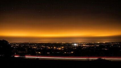 Fototapeta premium A mesmerizing long exposure captures the breathtaking beauty of a city skyline at dusk, with the streaks of light from passing vehicles painting a dynamic canvas.
