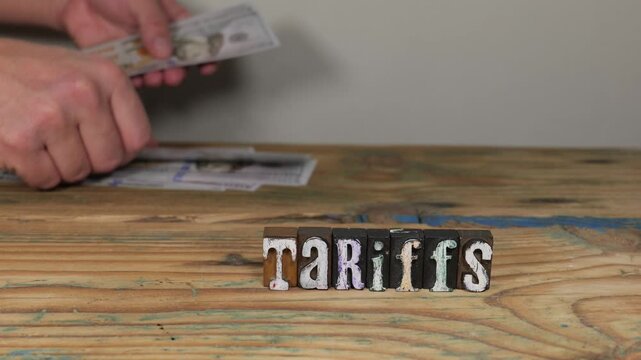 Hands Count Money Illustrating TARIFFS Effects On Pricing Decisions And Cross Border Commerce