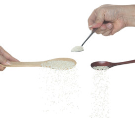 Japanese Rice fall, white grain rices pouring down abstract cloud fly from spoon. Beautiful...