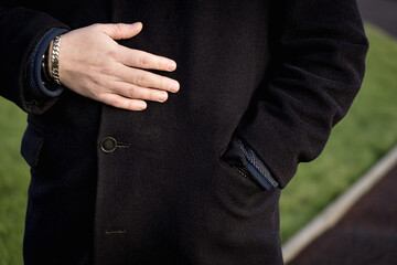 Obraz premium Man wearing coat, hand detail