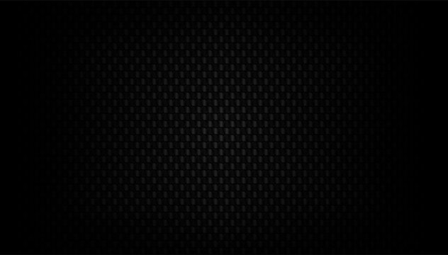 Black carbon fiber pattern with woven kevlar texture creates sleek background for modern automotive and industrial design applications