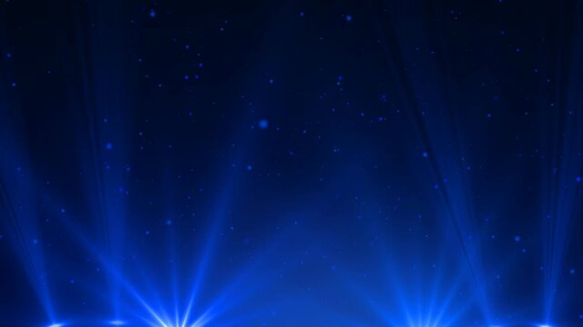 Blue Spotlight on stage. Moving banner with bright blue illuminating beams and sparkling particles flying upward. Awards ceremony or holiday show. Realistic graphic animated footage