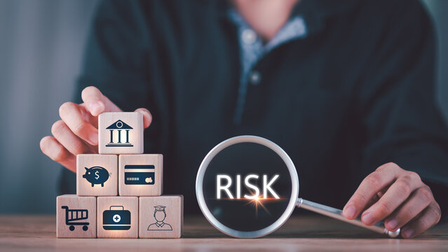 Financial analysts assess business risks using symbolic blocks and magnifying glass tools, representing credit risk, insurance planning, consumer protection, and structured financial management.