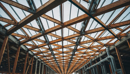 Naklejka premium Dramatic upward perspective reveals exposed wooden beam ceiling structure in contemporary sustainable manufacturing facility