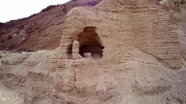 Cinematic Aerial View of Qumran Caves Near Dead Sea Jordan - Ancient Archeology and Biblical Heritage Site