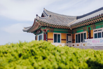 Fototapeta premium Busan, South Korea, Haedong Yonggungsa Temple view, Buddhist temple in Gijang-gun, coastal sea landscape with shrine facade exterior, Gijang County, Northern Busan, Yeongnam region, sunny spring day