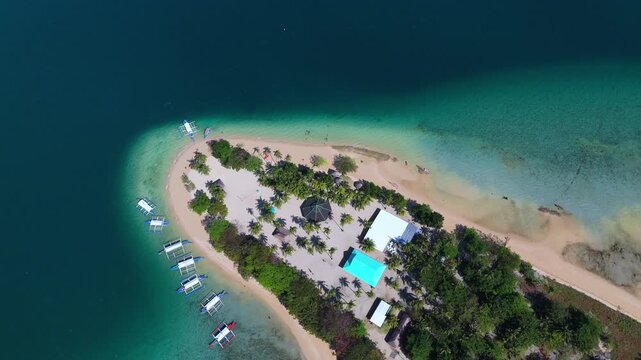 aerial drone shot of Cowrie Island in Honda Bay, Palawan island travel destination in Puerto Princesa 