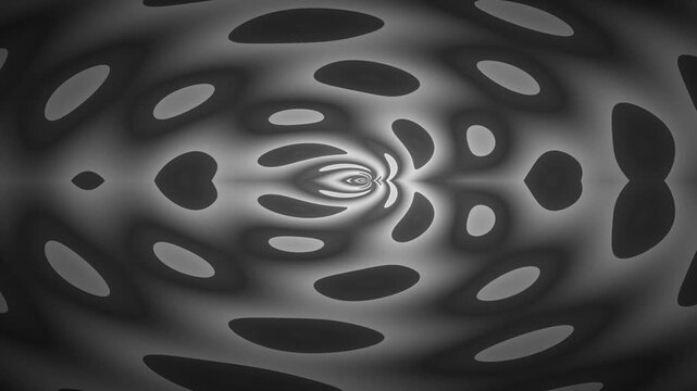 Abstract black and white pattern with oval shapes and a central design.