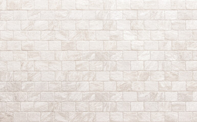 Fototapeta premium Detail of modern cream brick wall background photo. White light brick wall texture background for stone tile block painted in beige light color wallpaper modern interior and exterior backdrop design.