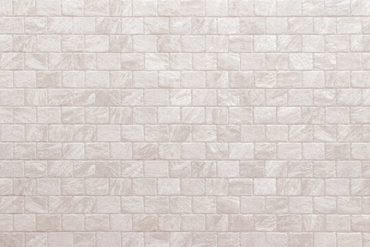 Detail of modern cream brick wall background photo. White light brick wall texture background for stone tile block painted in beige light color wallpaper modern interior and exterior backdrop design.