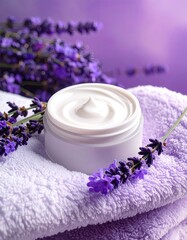 Cream jar with lavender on soft purple towel