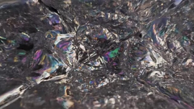 Close-up of iridescent opal gemstone with shimmering colors and dark background, mineral specimen