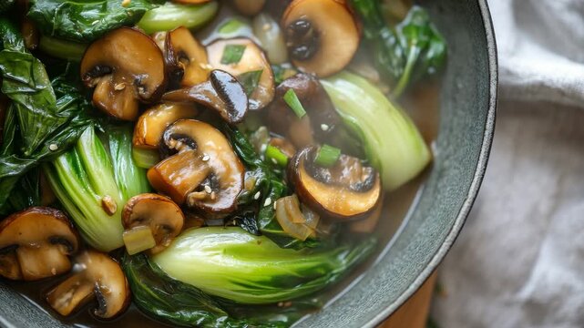 Stir-fried bok choy with mushrooms on plate
