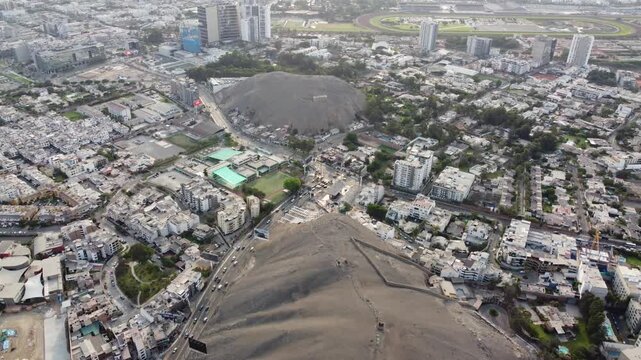 Aerial view la molina hill lima showcasing arid summit overlooking dense white residential