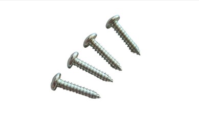 Set of Four Stainless Steel Metal Screws Isolated on White Background for Construction.