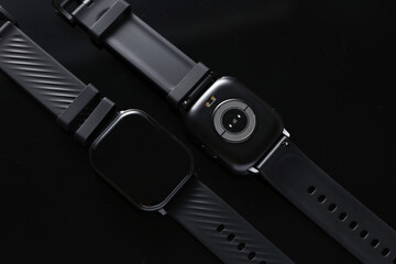 New smart bracelets watches on a black background