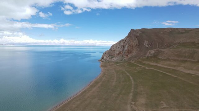 Drone Push Towards Crystal Clear Turquoise Waters of Siling Lake, Remote Tibet China