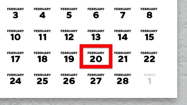 The date February 20th marked with a red cursor on the wall calendar 2026