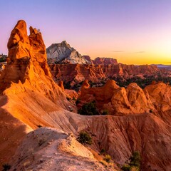 Obraz premium A serene desert landscape at sunset with unique rock formations