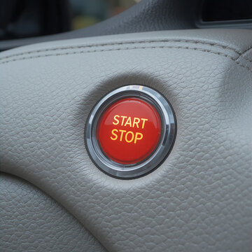 Car interior with illuminated start stop button set in textured leather dashboard, signaling readiness for urban commute or road trip.