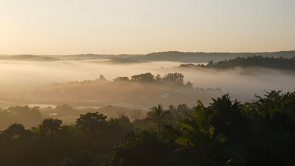 Sunset over foggy valley