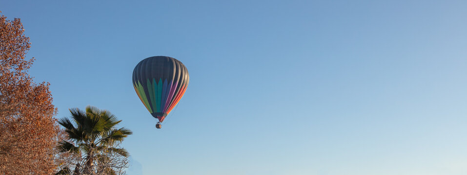 Hot air balloon in the early morning golden hour over the Temecula Valley in southern California United States