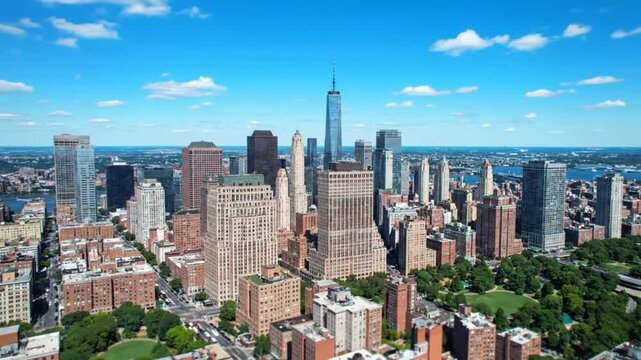 Stunning aerial footage captures the vibrant energy and iconic skyline of downtown Manhattan on a beautiful sunny day