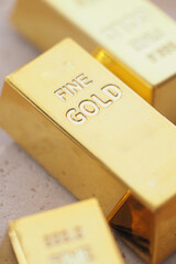 Gold bars placed on a table in a bright setting
