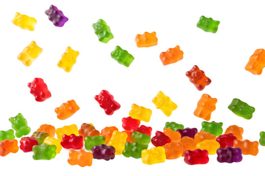Floating colorful gummy bear candies isolated on transparent background