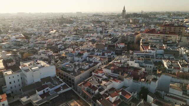 Panning aerial video showcases a scenic view of Seville, Spain. Drone capture.