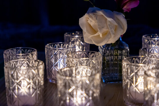 Candles with white flower in dark