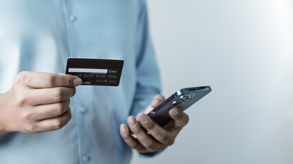 Cashless payment concept showing credit card and smartphone for secure digital transactions....