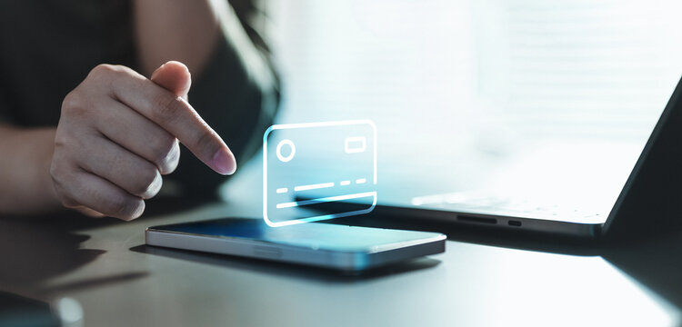 Secure digital payment concept with virtual credit card interface above smartphone and laptop. Represents digital wallet, online transaction, financial technology, wireless payment, data protection.