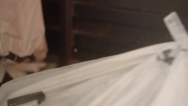 Delivery man scanning custom QR code label at logistic warehouse, e-commerce distribution, Closeup